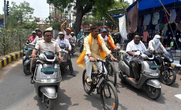 BJP functionaries use bike, cycle to reach office