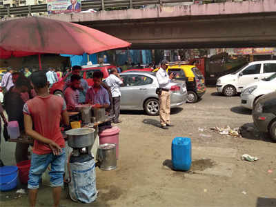 In pictures: Hawkers continue to cook roadside in Lower Parel area even after BMC's ban