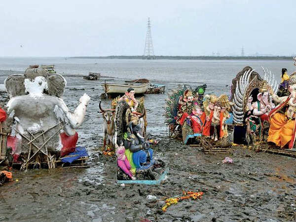 Idols abandoned on shores of Dumas during low tide