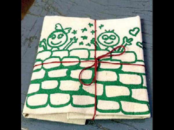 Going green: Groom prints wedding invite on cloth bags