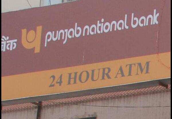 Bank officials down shutter to hide from irate customers