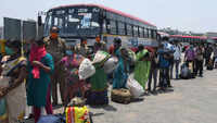 Bengaluru: Migrant workers rush to Majestic bus terminal to leave for their native places 