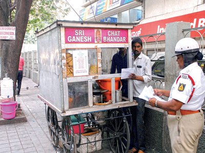 Traffic police, BBMP officials join hands to clear out all encroachments from footpaths