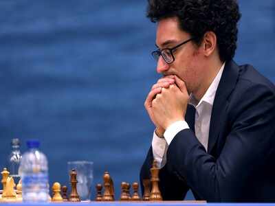 Fabiano Caruana joins Magnus Carlsen at the top on a day of two Armageddons