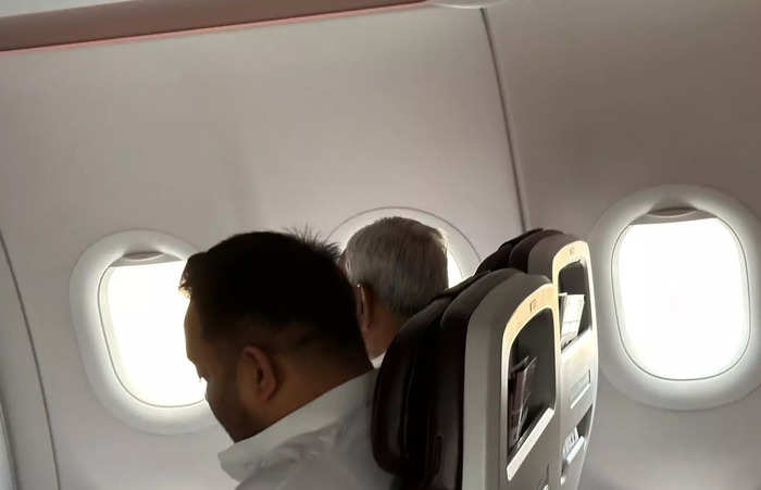 Viral photo of Bihar CM-JD(U) leader Nitish Kumar and RJD leader Tejashwi Yadav travelling to Delhi on the same flight. Both of them were travelling to Delhi for NDA meeting and INDIA bloc meeting respectively.