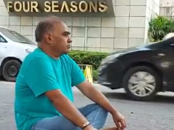 I-T raid: BJP leader PVS Sarma protests outside his residence in Surat