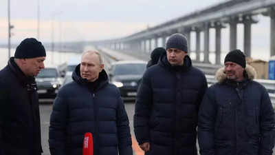 Russia-Ukraine war: Putin drives across repaired Crimea bridge as Russia launches new missile attacks