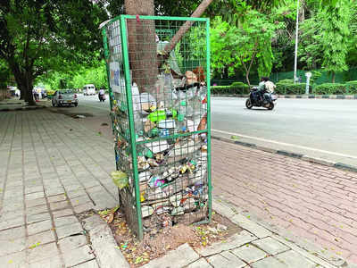 Bins of shame: Tree guards at Cubbon Road turn into dustbins