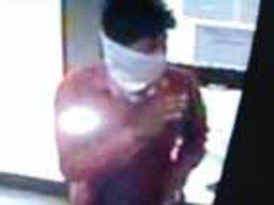 Gunman robs woman in ATM