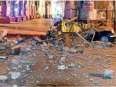 Cab crushed under slab collapse; driver survives