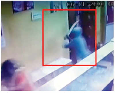 Youth caught on CCTV attacking woman with sword