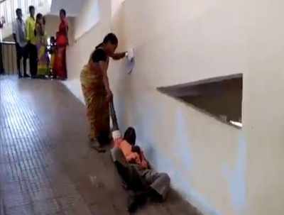 Denied stretcher, woman drags husband on hospital ramp