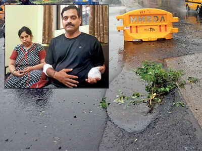 Mumbai rains: Motorbike-bound couple hit a perilous pothole