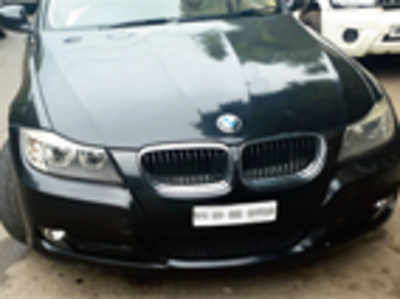 A seized BMW and its nonchalant owner leave RTO officials bemused