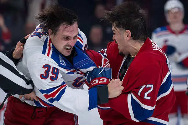 Montreal Canadiens defenseman Arber Xhekaj drops Buffalo Sabres forward Sam Carrick during chaotic NHL Game 3