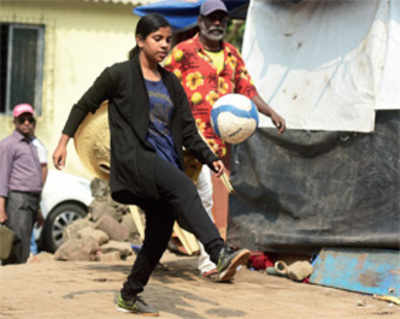 Footballer feted by Modi strives to leave footpath