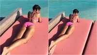 Mandira Bedi flaunts her curvacious body in neon pink bikini! 