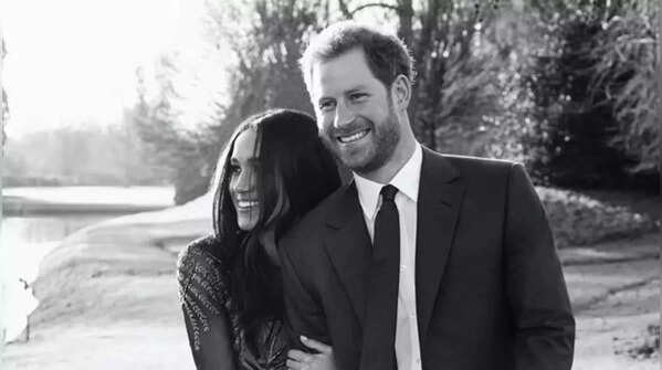 Meghan holds Harry's arm