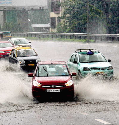 Trains, cars crawl as rains lash city