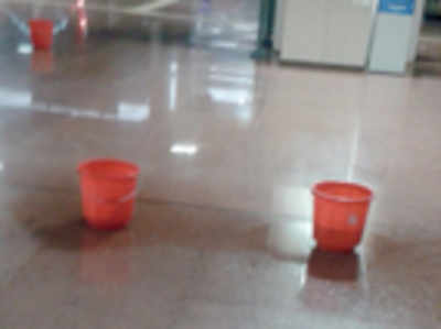 Buckets collect leaking water at metro station