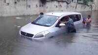 Delhi: Heavy rain leads to traffic snarls; car gets stuck at waterlogged Zakhira underpass 