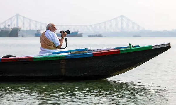 Modi visits Bengal’s ‘soul’, chats up boatmen, walkers