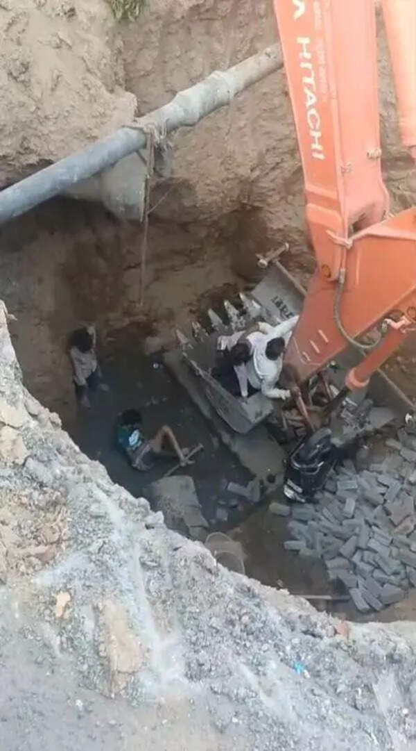 Mother, son fall into 20-ft metro excavation pit