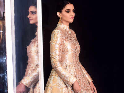 Sonam Kapoor looks royal in a gold outfit at a recent event