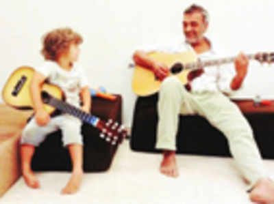 Little Lucky: Strumming along with Dad