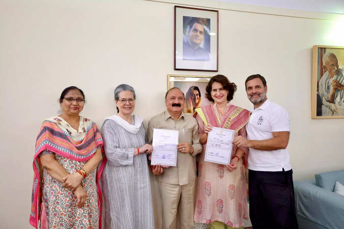Congress party's newly-elected MP from Amethi, Kishori Lal Sharma shows his winning certificate as he meets Congress Parliamentary Party Chairperson Sonia Gandhi, General Secretary Priyanka Gandhi Vadra and MP Rahul Gandhi.