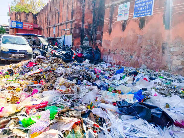 Beyond the one-day clean-up: walled city residents struggle with daily garbage piles