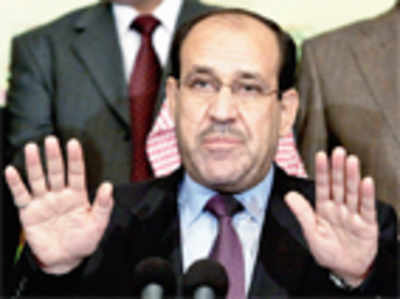 Maliki steps down, backs rival for PM