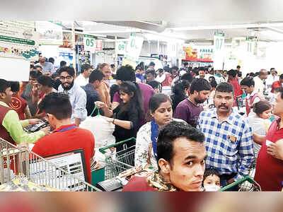 Panic in city amid partial lockdown: Govt shuts down theatres, gyms, swimming pools; citizens throng stores to stock up on essentials