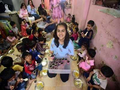 14-year-old Renaye Tejani gifts cup cakes to Anganwadi children