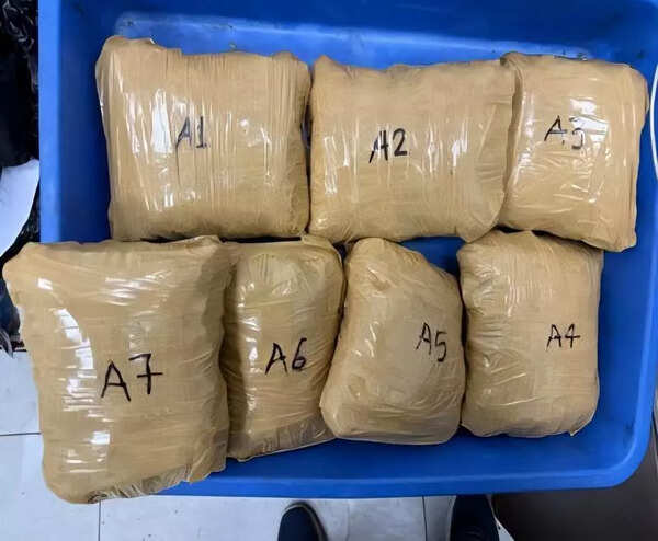 2kg of cannabis left on aircraft for domestic leg; 3 held