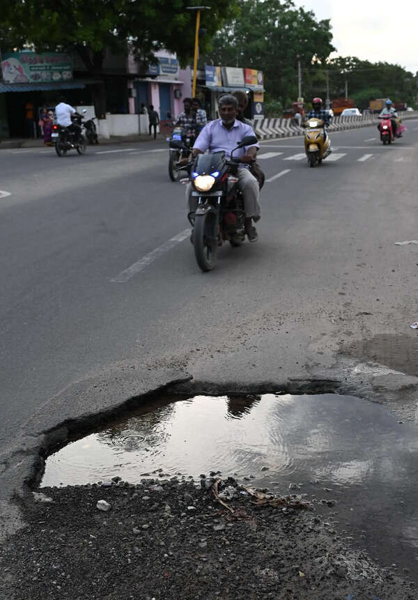 Potholes on Iravathanallur Main Road put motorists at peril