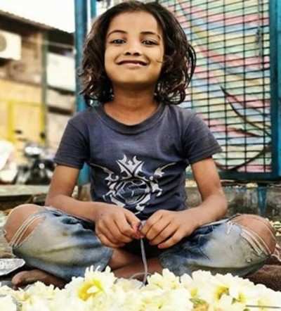 9-yr-old flower seller face of child labor