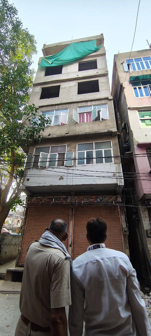Fear in Walled City after pillar shifts during illegal construction