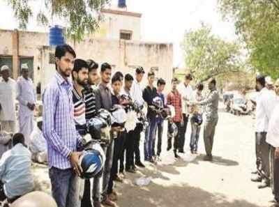 After losing children to a road accident, families distribute helmets to create road safety awareness