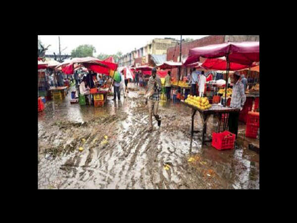 Rains turn grain market into swamp