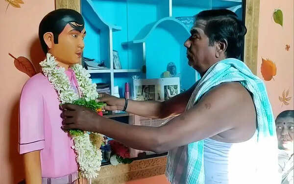 Parents worship lifesize statue of deceased son for 26 years