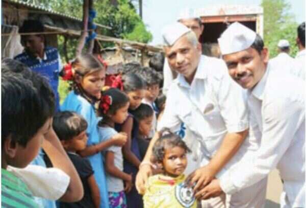 Dabbawalas distributing clothes in the tribal areas of Palghar