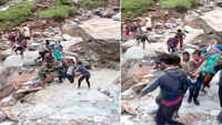 Locals carry patient on makeshift plank due to unavailability of road in Pithoragarh 