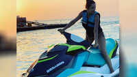 Malaika Arora flaunts her curvacious body on water bike!  
