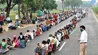 Migrant workers desperate to go home turn up without passes at Chandigarh ISBT 