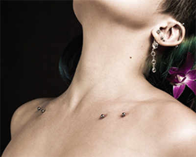 29 Tattoo Design Ideas With Dermal Piercings To Add Glam To Your Ink   YourTango
