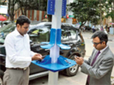 Five sun-powered mobile phone charging units in city