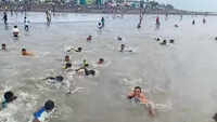 Watch: Youngsters playing cricket jump into sea on seeing cops at Virar beach 