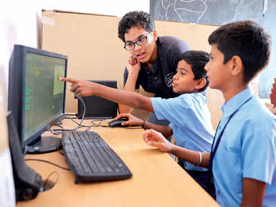 Two 15-year-olds are teaching basic computing skills to government school students