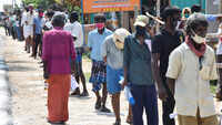 Coimbatore: Two Spain nationals stand in queue, buy liquor from a TASMAC shop 